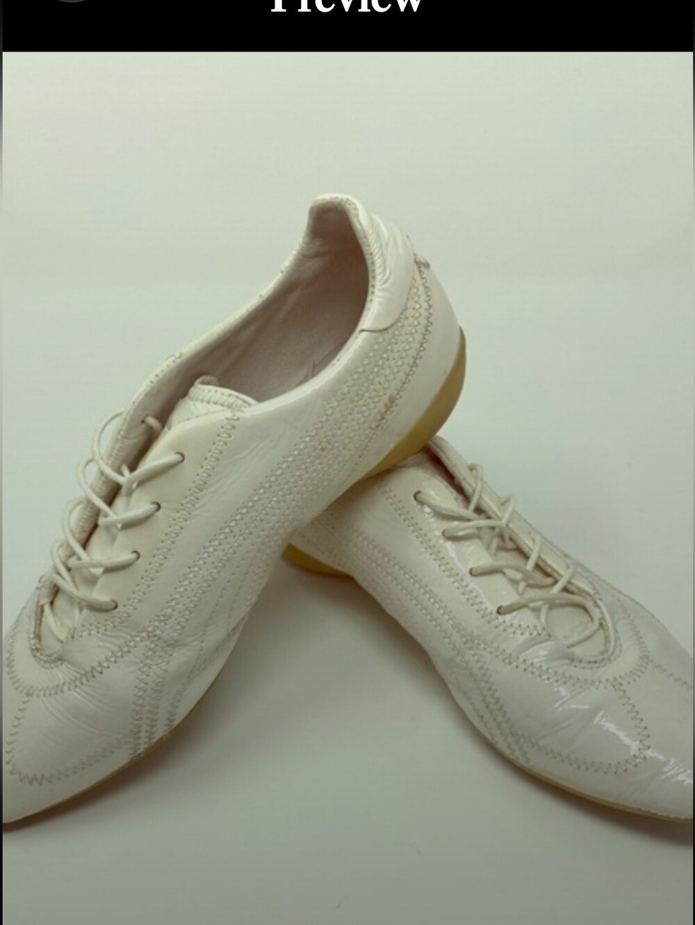 Puma white patent leather lace up shoes